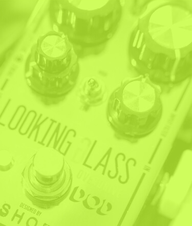 DOD Looking Glass class-a fet overdrive guitar pedal close up in a transparent green