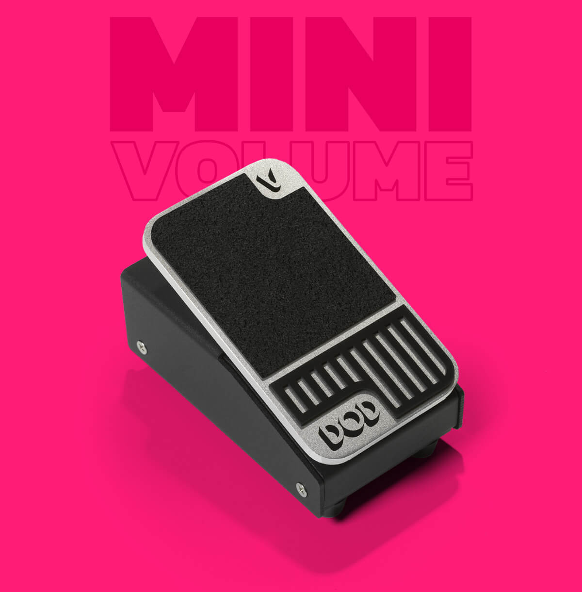 DOD Mini Volume ultra compact volume guitar pedal in black and silver with pink background that says 