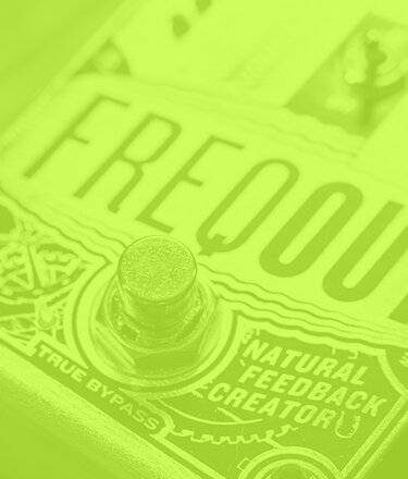 DigiTech Freqout natural feedback creator guitar pedal close up in a transparent green
