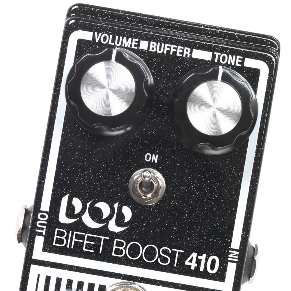 close up of DOD Bifet Boost 410 distortion overdrive guitar pedal volume, buffer, and tone knobs