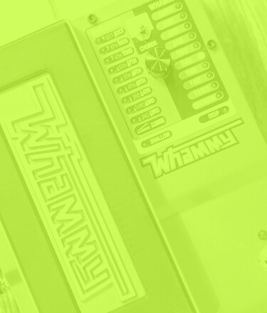 DigiTech Whammy pitch shift effect guitar pedal close up in a transparent green