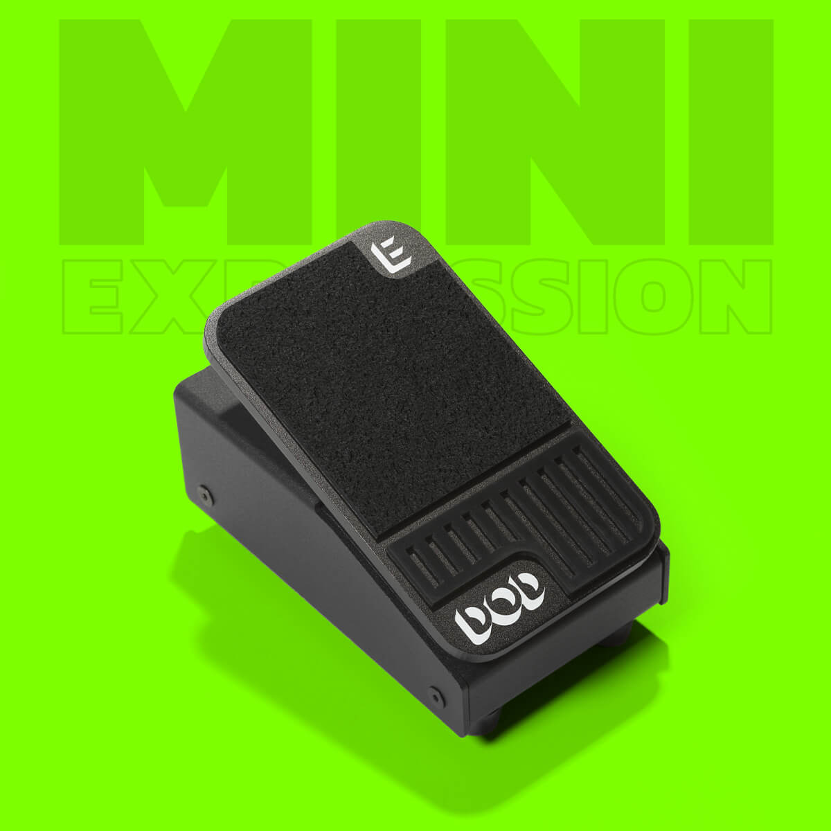 DOD Mini Expression ultra compact expression guitar pedal in black with green background and graphics that says 